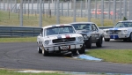 Darrin Davies in the ex-John Mann Mustang led before biffo from behind