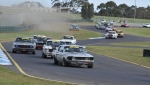 Rod Hotchkin\'s Falcon spins out while ACT\'s Ben Wilkinson leads the pack into Dandenong Rd corner