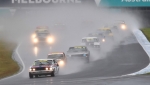 Jason Humble's Mazda waits to pounce on Andy Clempson's Mustang to take the wet race win.