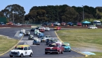 Stephen Hoade leads Claude Ciccotelli's EH and Banny Berry's Mini into Turn 2