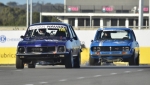 Nathan-Gordon’s-Torana-XU-1-leads-Kirk-Davis’s-Mazda-RX2-up-the-main-straight.